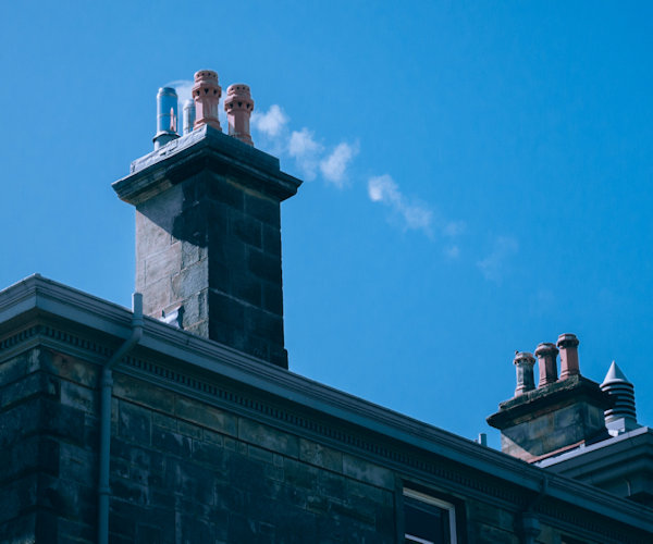 Show chimney smoking non-smokeless fuel